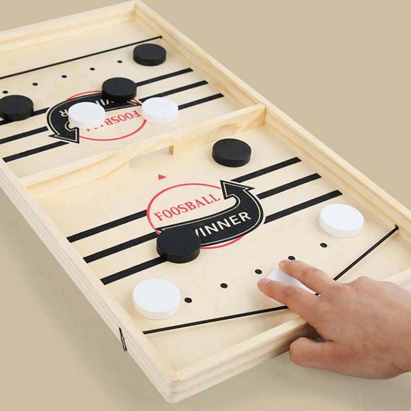 Gameplay—two sides racing to clear their pucks